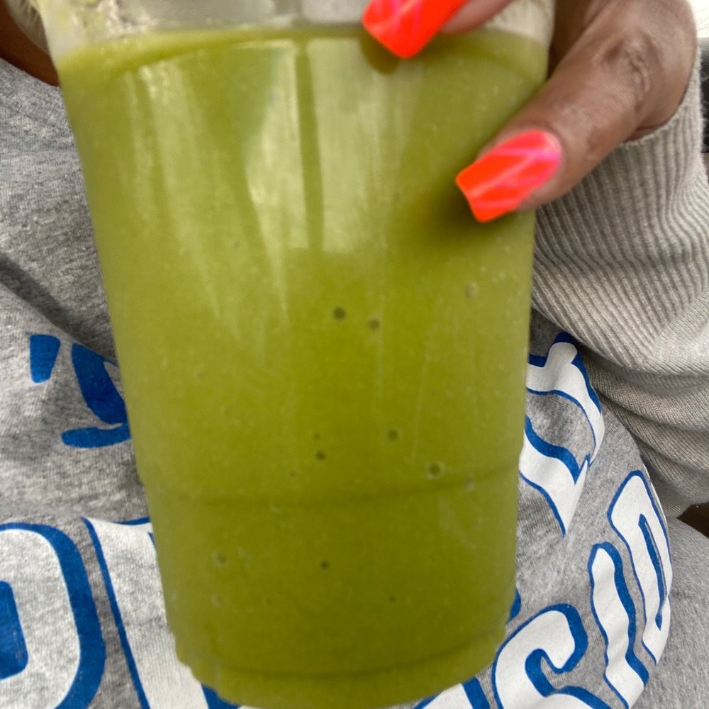 Georgetown Market - a woman holding a cup of green juice - Health Markets Near Me - Indianapolis, Indiana Georgetown Market - a woman holding a cup of green juice - Health Markets Near Me - Indianapolis, Indiana