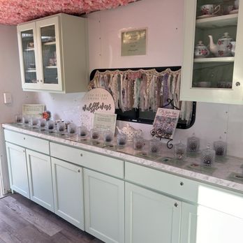 The Tea Charmer - a kitchen with white cabinets and marble counter tops - Tea Rooms Near Me - New Braunfels, Texas The Tea Charmer - a kitchen with white cabinets and marble counter tops - Tea Rooms Near Me - New Braunfels, Texas