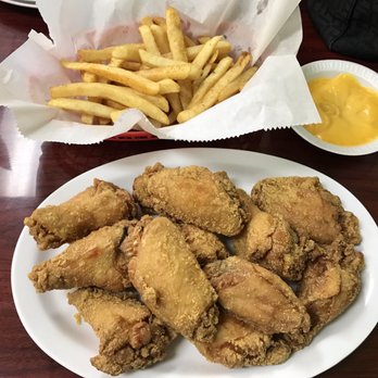 Cajun Crawfish - Crispy and juicy wings with no sauce and fries with warm cheese was amazing!!! - Cajun/Creole Near Me - Houston, Texas