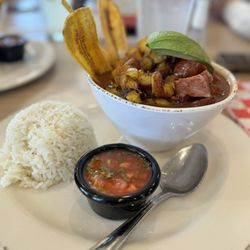 Cali Colombian Restaurant - Delicious Cazuela con Frijoles. Rice, beans, pork belly, sausage, plantain chips with rice.
