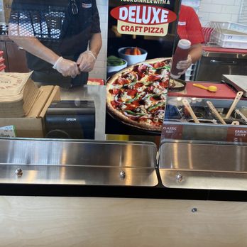Rapid Fired Pizza - a man making a pizza - Pizza Near Me - Easley, South Carolina Rapid Fired Pizza - a man making a pizza - Pizza Near Me - Easley, South Carolina