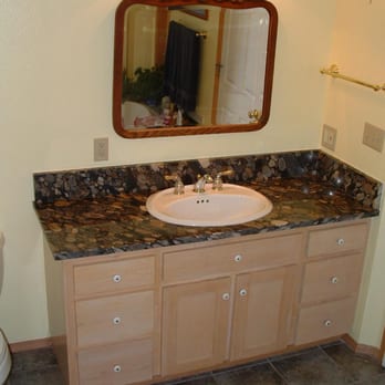 Rapid Remodeling - a bathroom with a sink and toilet - General Contractors Near Me Rapid Remodeling - a bathroom with a sink and toilet - General Contractors Near Me