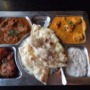 Mint Indian Cuisine - combination meal. Clockwise from top: Chicken Tikka masala, yogurt,tandoori chicken and lamb curry. Rice and naan in the center - Indian Near Me - Boone, North Carolina Mint Indian Cuisine - combination meal. Clockwise from top: Chicken Tikka masala, yogurt,tandoori chicken and lamb curry. Rice and naan in the center - Indian Near Me - Boone, North Carolina