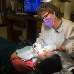 Stonewood Dental - Hygienist Debbie King working with a patient.