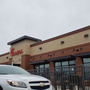 Chick-fil-A - ows two cars parked in front of a restaurant - Fast Food Near Me - Greendale, Wisconsin