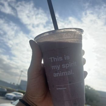 Earthbar - a hand holding a cup of coffee - Juice Bars & Smoothies Near Me - Hawthorne, California