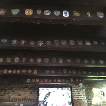 Boondock Saint - Police badge on rafters - Dive Bars Near Me - New Orleans, Louisiana