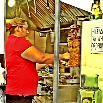 Tacos Acapulco - This is the real deal...carving some al pastor for the tacos - Mexican Near Me - Denver, Colorado