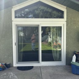 New 96x80 sliding glsss door and window above
