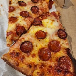Cheese and pepperoni pizza slices
