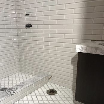 Kudrik Brothers - a shower in a bathroom - Flooring Near Me Kudrik Brothers - a shower in a bathroom - Flooring Near Me