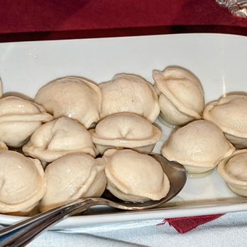 Danubius Restaurant - Coltunasi (traditional dumplings made with cheese, meat & potatoes); comes with side of sour cream $9 - Modern European Near Me - Sunnyside, New York
