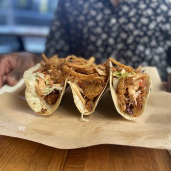 Trio Restaurant - a person holding a plate of tacos - Juice Bars & Smoothies Near Me - Cape Girardeau, Missouri Trio Restaurant - a person holding a plate of tacos - Juice Bars & Smoothies Near Me - Cape Girardeau, Missouri