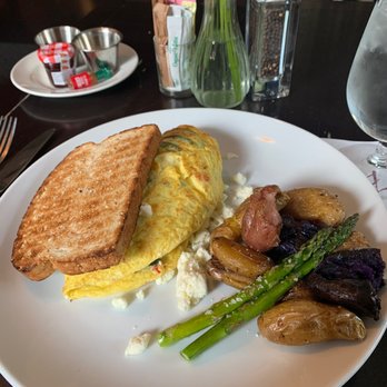 Monarch - Veggie and feta omelet with breakfast potatoes - New American Near Me - Houston, Texas Monarch - Veggie and feta omelet with breakfast potatoes - New American Near Me - Houston, Texas