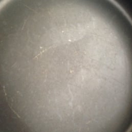 Calphalon pan after normal use of 8 months. Nicks and scratches