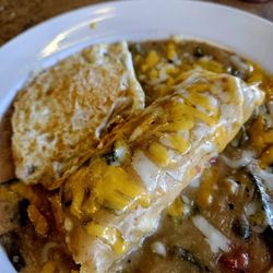 Lydia's La Canasta - Tamales enchilada style with an egg!