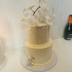 The Cake Cottage - Vanilla with vanilla bean buttercream and almond cake with rose buttercream wedding cake with fresh orchids on top