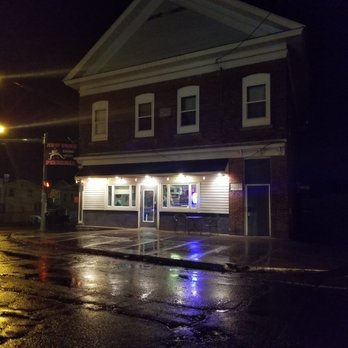 New York Pizzeria - a wet street at night - Pizza Near Me - Cato, New York New York Pizzeria - a wet street at night - Pizza Near Me - Cato, New York