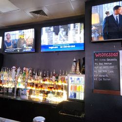 The Hollow - Bar with many TVs showing various sports and Men In Black