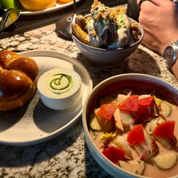 Rose's - left to right: bread service, potatoes, scallop crudo - New American Near Me - Virginia Beach, Virginia Rose's - left to right: bread service, potatoes, scallop crudo - New American Near Me - Virginia Beach, Virginia
