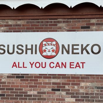 Sushi Neko - a sign on a brick wall - Sushi Bars Near Me - Arvada, Colorado