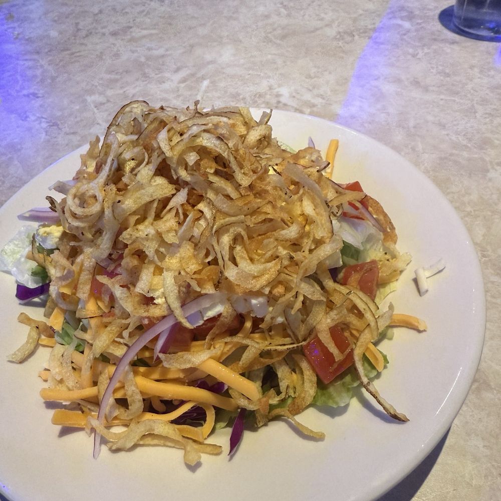 Bubba's 33 - Side Salad. It's huge. Came with crispy potato shavings, lettuce, tomato, egg, red onions, cheddar cheese. I got blue cheese dressing. - American Near Me - Tempe, Arizona