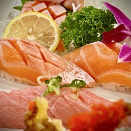 Sea of fatty tuna and salmon sashimi and sushi.