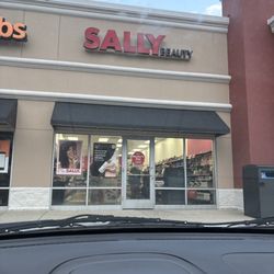 Sally Beauty - Front window, ( Awesome/A Team) Staff Closing up for the day