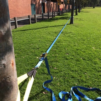 Princes Park - Slacklining in the sunshine. Remember to protect the trees :) - Playgrounds Near Me - Carlton North, VIC