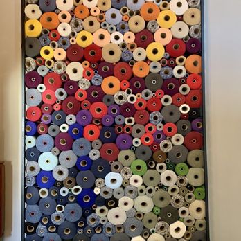 Hotel Millwright - Wall of yarn in the lobby area. - Hotels Near Me - Amana, Iowa Hotel Millwright - Wall of yarn in the lobby area. - Hotels Near Me - Amana, Iowa