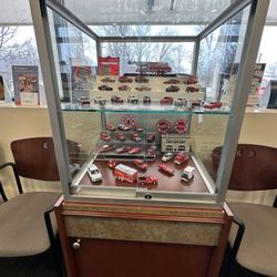 Professional Eye Care Center - Fire vehicle miniatures display in the waiting area