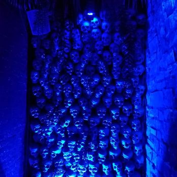 Three Dots and A Dash - Entry featuring wall of skulls. This is impressive, but theming beyond this point falls short. - Asian Fusion Near Me - Chicago, Illinois Three Dots and A Dash - Entry featuring wall of skulls. This is impressive, but theming beyond this point falls short. - Asian Fusion Near Me - Chicago, Illinois