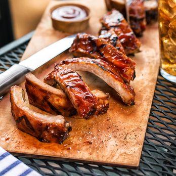 Tony Roma's - ribs on a cutting board with a knife - Steakhouses Near Me - Medicine Hat, Alberta Tony Roma's - ribs on a cutting board with a knife - Steakhouses Near Me - Medicine Hat, Alberta