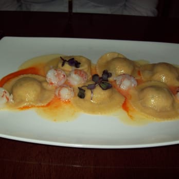 Lupo - Dungeness crab ravioli with butternut squash, baby shrimp & lobster bisque sauce. - Italian Near Me - Vancouver, British Columbia Lupo - Dungeness crab ravioli with butternut squash, baby shrimp & lobster bisque sauce. - Italian Near Me - Vancouver, British Columbia