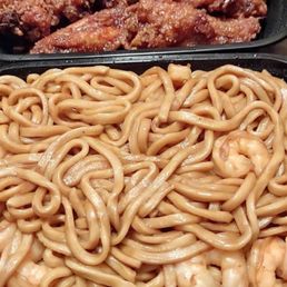 two trays of noodles and meat two trays of noodles and meat