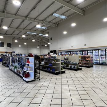 Lupton Truck Stop - A spacious convenience store interior features refrigerated units along the back wall and shelves stocked with various products. - Service Stations Near Me - Lupton, Arizona