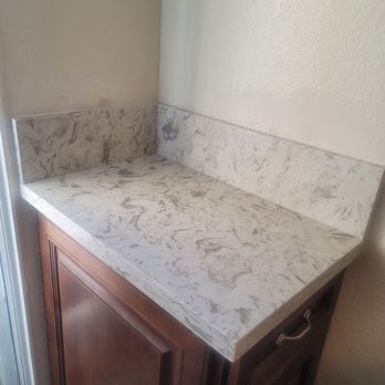 New Level Stone & Tile - As they were putting countertop on small kitchen drawer. - Countertop Installation Near Me