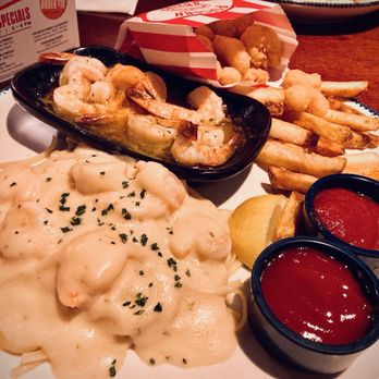 Red Lobster - Weekday Shrimp Trio: Shrimp Linguini Alfredo, Shrimp Scampi and Popcorn Shrimp w/ fries - Seafood Near Me - Reno, Nevada Red Lobster - Weekday Shrimp Trio: Shrimp Linguini Alfredo, Shrimp Scampi and Popcorn Shrimp w/ fries - Seafood Near Me - Reno, Nevada
