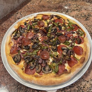 Breadsmith - The finished product. Green pepper, jalapeño, red onion, sausage, pepperoni and mozzarella. - Bakeries Near Me - Oro Valley, Arizona