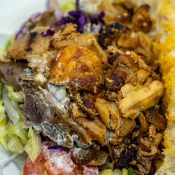 Döner Haus - Döner Sandwich, with beef and chicken: $12.99; $14.14 with tax. Take-out, shown with pita bread peeled back. - German Near Me - New York, New York Döner Haus - Döner Sandwich, with beef and chicken: $12.99; $14.14 with tax. Take-out, shown with pita bread peeled back. - German Near Me - New York, New York
