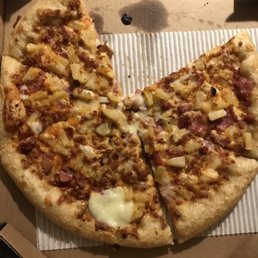 a half eaten pizza in a box