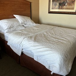 Housekeeping making the bed. Housekeeping making the bed.