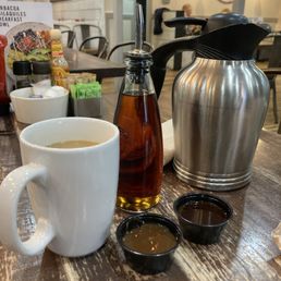 Coffee Pot, Caramel and Chocolate Sauces, Syrup, Table