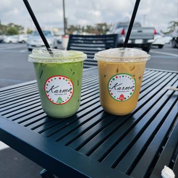 Karma Espresso Bar - On the left is a matcha latte with blueberry and on the right is an iced vanilla latte. - Coffee & Tea Near Me - San Antonio, Texas Karma Espresso Bar - On the left is a matcha latte with blueberry and on the right is an iced vanilla latte. - Coffee & Tea Near Me - San Antonio, Texas