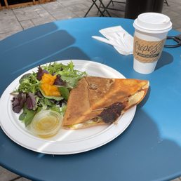 Breakfast crepé with side salad and Cafe au lait