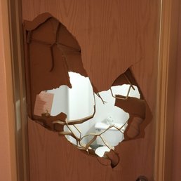 Hole in the bathroom door of room 326 of Motel 6 in Redmond, OR. Hole in the bathroom door of room 326 of Motel 6 in Redmond, OR.