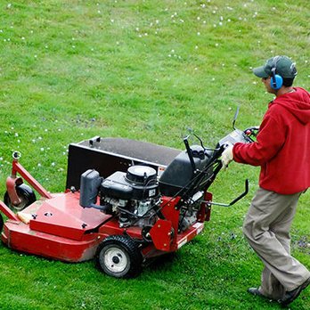 Crew Cut Lawn & Backflow Testing - a man mowing the grass - Landscaping Near Me Crew Cut Lawn & Backflow Testing - a man mowing the grass - Landscaping Near Me