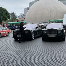 2 of their rolls Royce fleet for transportation to and from the airport