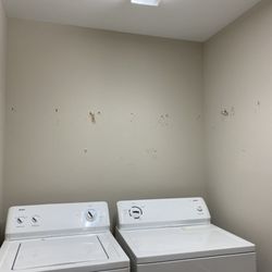Stonehaven Remodeling Services - Laundry room before with wire shelf taken down