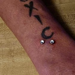 Truth and Triumph Tattoo - Snake bite dermal piercing